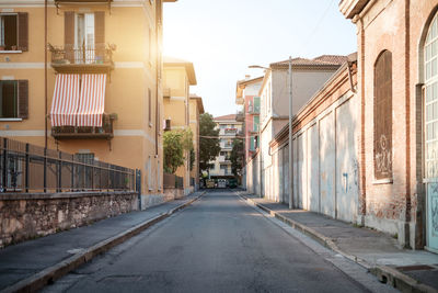 Street amidst buildings against sky