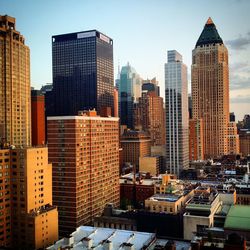 Modern buildings in city against sky