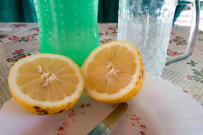 Close-up of citrus fruit slices in plate on table