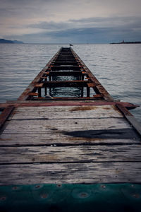 Pier over sea against sky