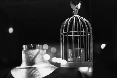 Close-up of electric lamp against black background