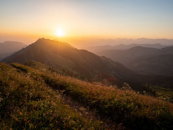 Scenic view of mountains against sky during sunset