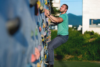 Full length of young man exercising on road