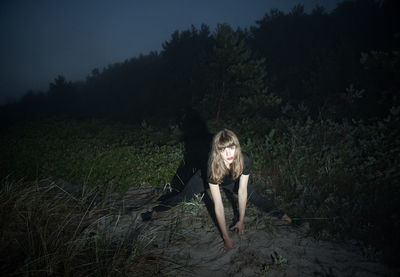 Full length portrait of woman in forest