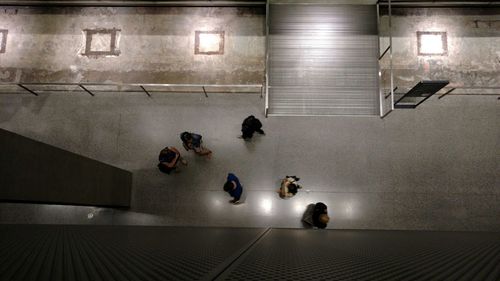 People in illuminated room