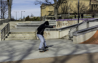 Full length of man skateboarding at park