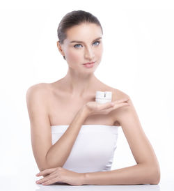 Portrait of a beautiful young woman over white background