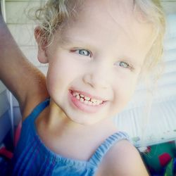 Close-up portrait of cute girl smiling