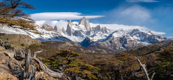 Scenic view of mountains against cloudy sky