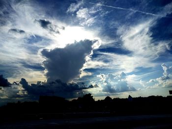 Scenic view of landscape against cloudy sky