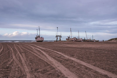 Boats at sandy beach
