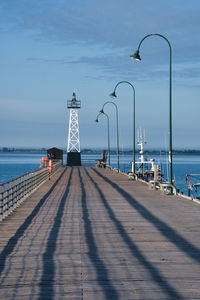 Pier over sea against sky