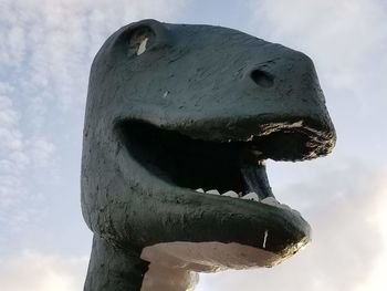 Low angle view of statue against sky