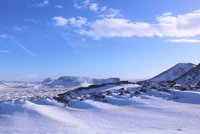 Scenic view of landscape against sky during winter