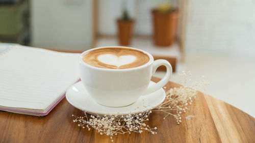 Close-up of cappuccino on table