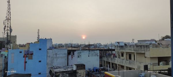 High angle view of buildings against sky during sunset