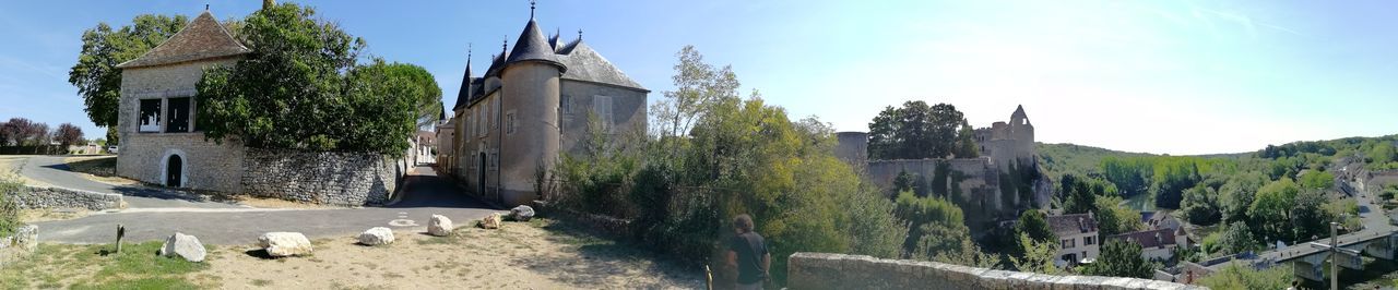 Panoramic view of old building and trees against sky