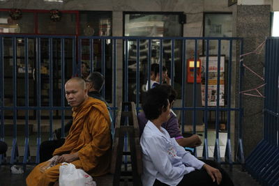 Rear view of people sitting in building