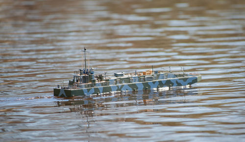 Remote controlled ship model is remote controlled on a lake