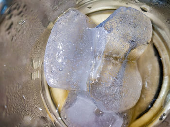 High angle view of ice cubes in water