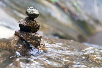 Close-up of stone stack on rock