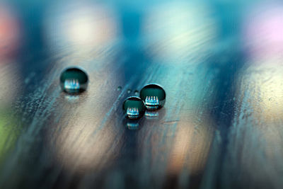 Close-up of water drops on table