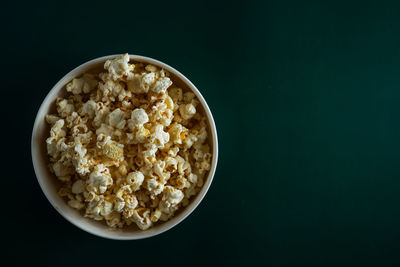 High angle view of breakfast in bowl against black background