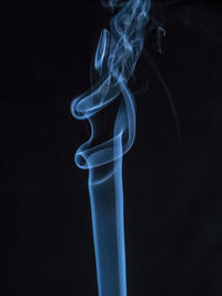 Close-up of smoke against black background