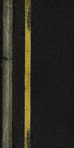 Full frame shot of yellow road marking