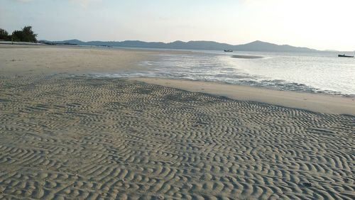 Scenic view of beach against clear sky