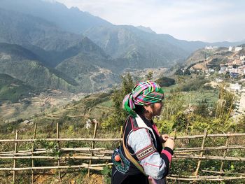 Rear view of woman looking at mountains