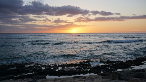 Scenic view of sea at sunset