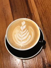 High angle view of cappuccino on table