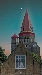 Low angle view of building against sky at night