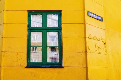 Closed door of yellow building