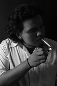 Young man smoking cigarette