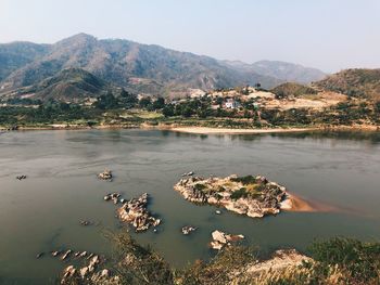 Scenic view of lake and mountains against sky