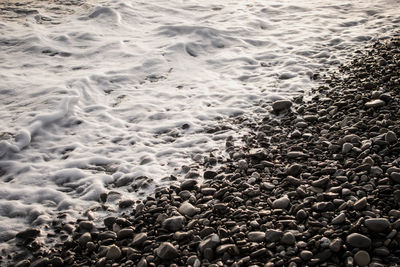 High angle view of pebbles on beach