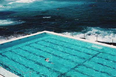 High angle view of infinity pool by sea