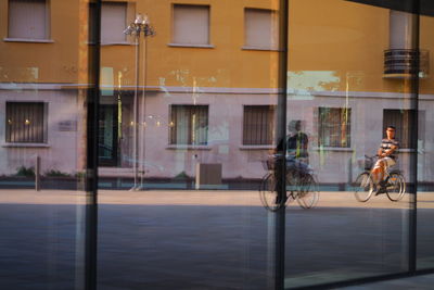 Reflection of building on glass window