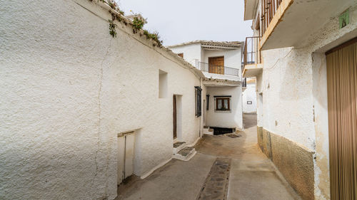 Alley amidst buildings in city