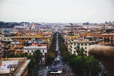 High angle view of city street and buildings against sky