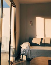 View of an empty seat on bed against wall at home