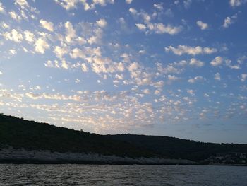 Scenic view of sea and mountains during sunset