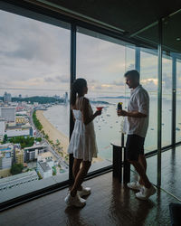 Rear view of couple standing in city