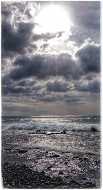 Scenic view of sea against cloudy sky