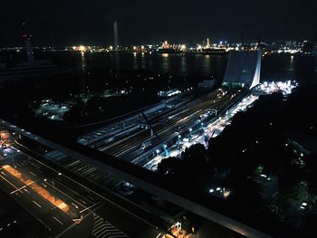 Aerial view of city lit up at night