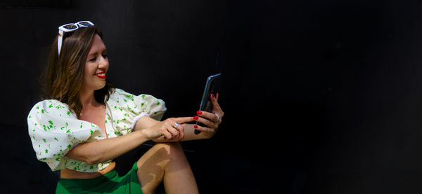 Young woman using mobile phone