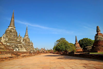 Empty path among the historic ruins of wat phra si sanphet and the royal palace, ayutthaya, thailand