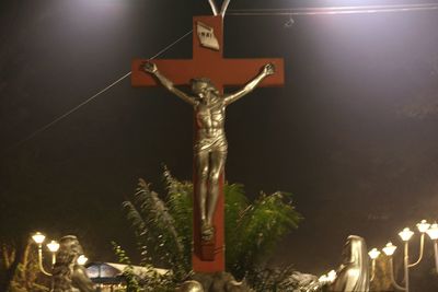 Low angle view of statue at night